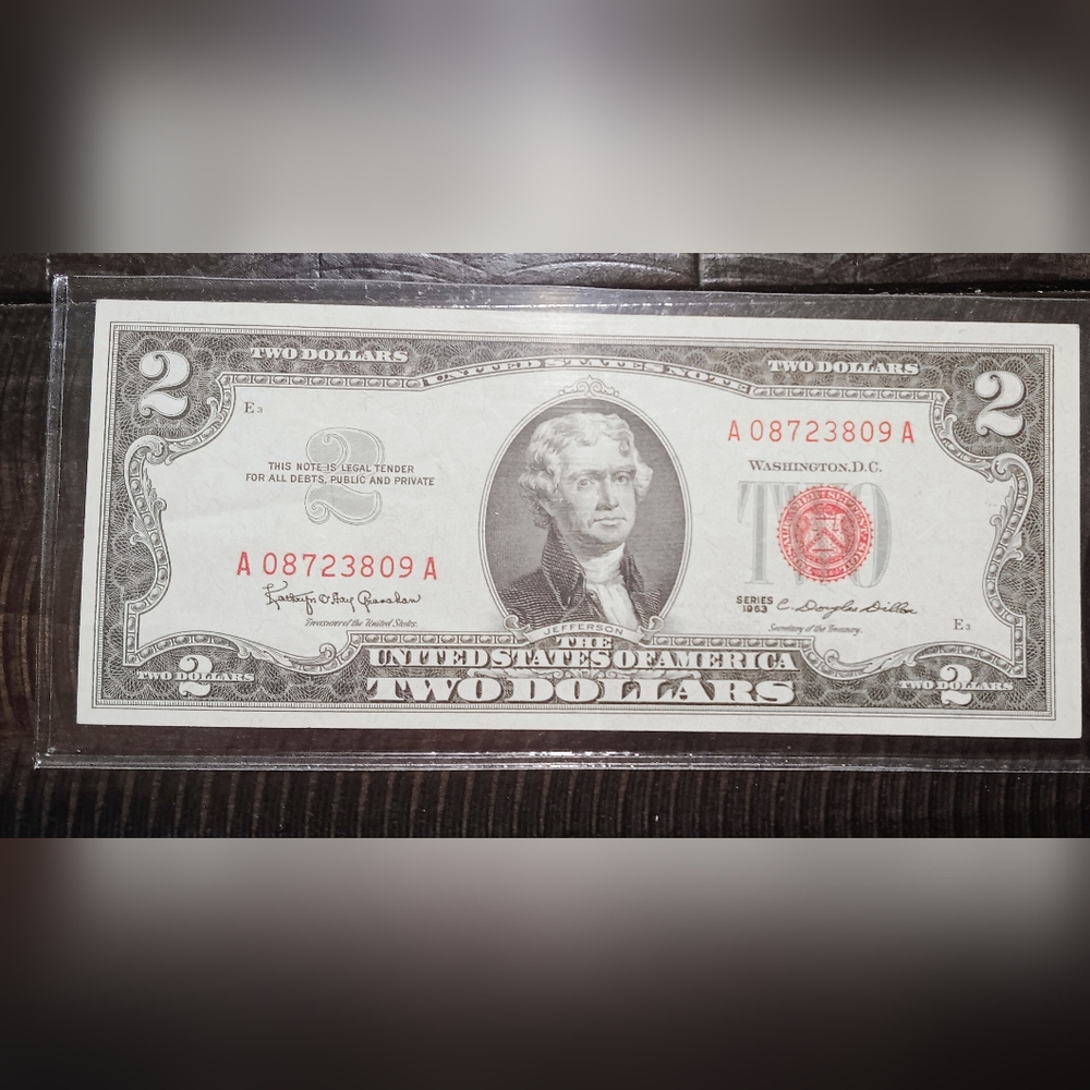 A 1963 TWO DOLLAR LEGAL TENDER NOTE,RED SEAL IN EXCELLENT CONDITION